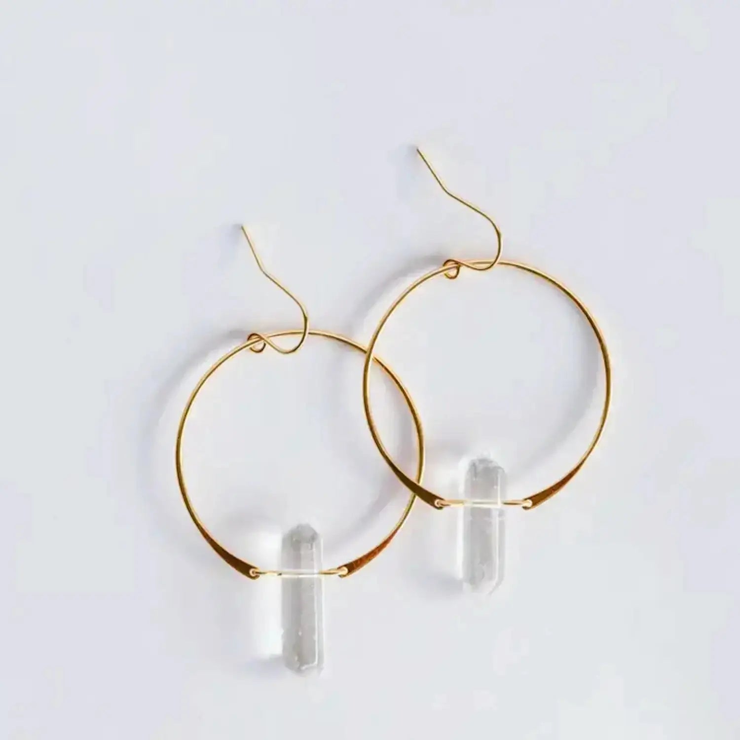 pair of yellow gold boho hoop earrings with long clear quartz stones by JaxKelly jewelry 