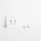 Gold earrings on a white card with 'Rose Quartz' text on a white background