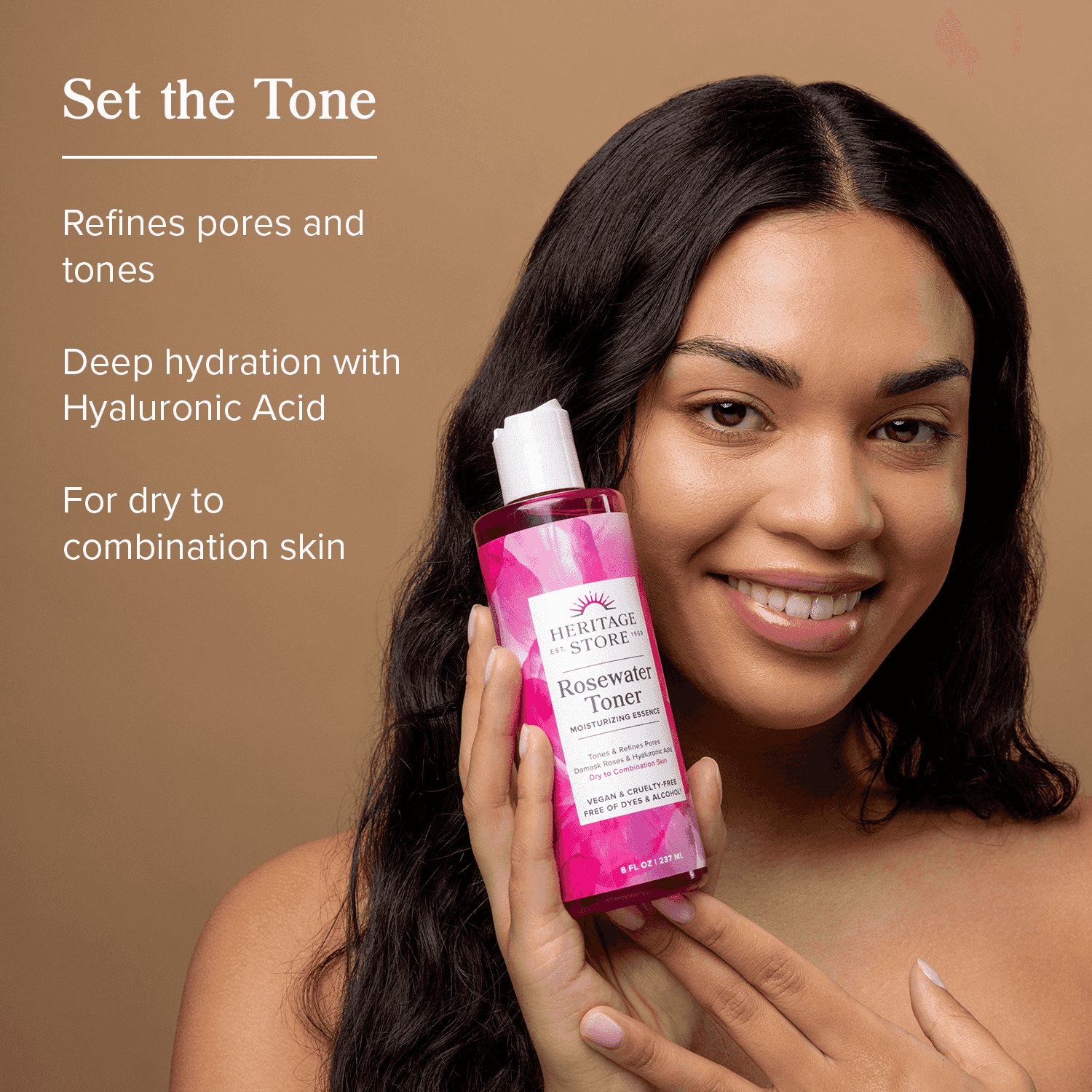 Woman holding Heritage Store Rosewater Toner Mini for glowing skin; ideal for dry to combination skin with hyaluronic acid hydration benefits.