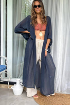 Indigo Blue Long Kimono Duster made of lightweight ramie cotton, styled with a macrame belt and three-quarter sleeves for a boho-chic look.