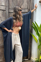 Indigo Blue Long Kimono Duster in lightweight ramie cotton styled with a crop top and wide-leg pants. Features boho-chic design and flowy silhouette.