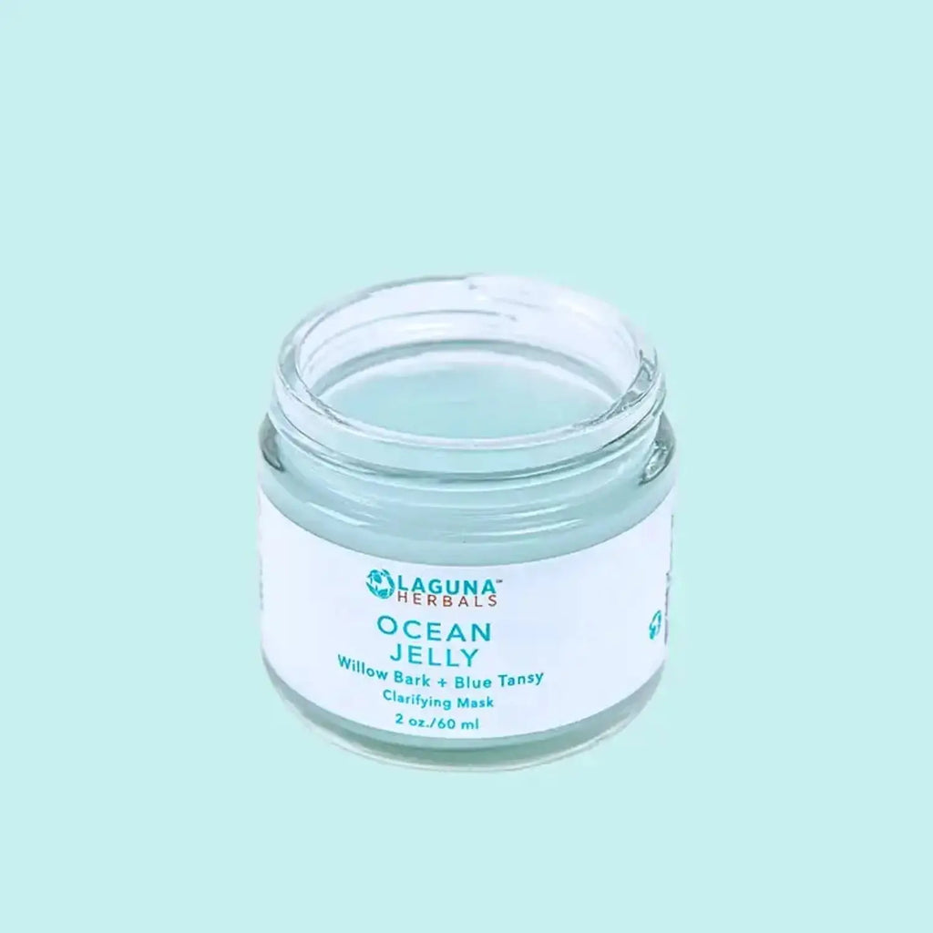 a jar of gel face mask on a blue background