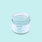 a jar of clarifying gel face mask on a blue background