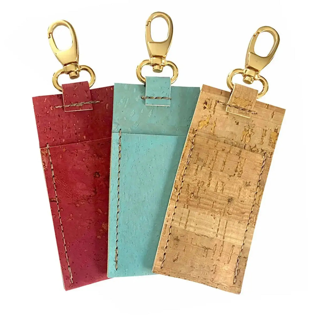 Lip balm holder and lipstick cases shown in red, blue and tan colors.
