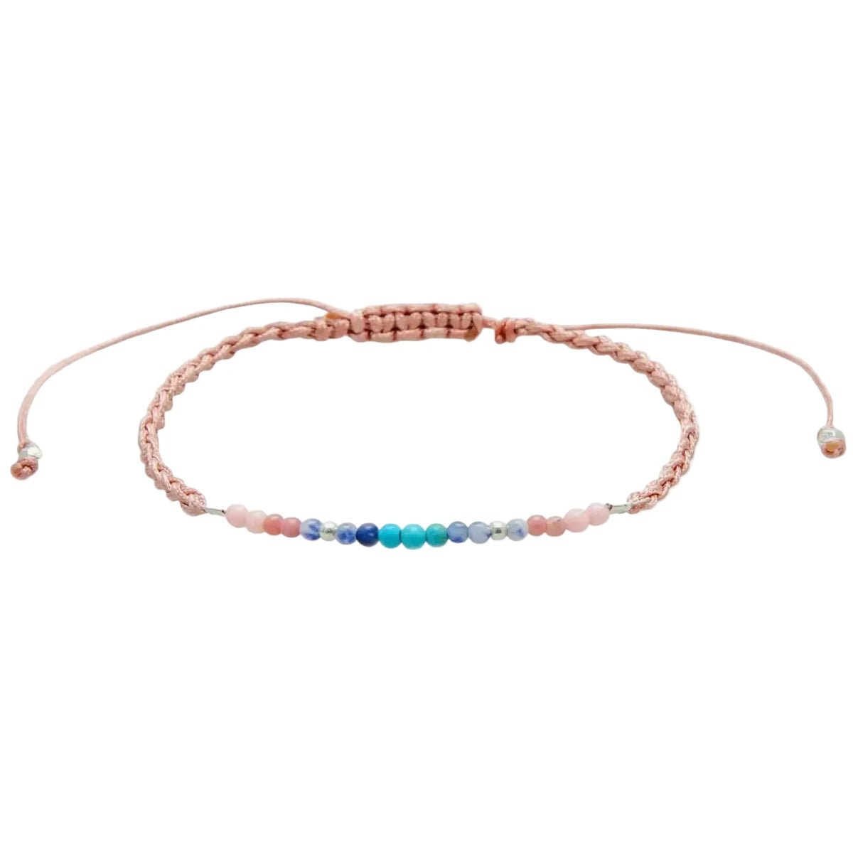 A delicate peach-pink beaded bracelet with a central row of multicolor beads in shades of blue, green, and purple.