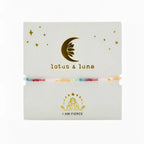 multi colored crystal bracelet with blue silder cord on lotus and luna jewelry card