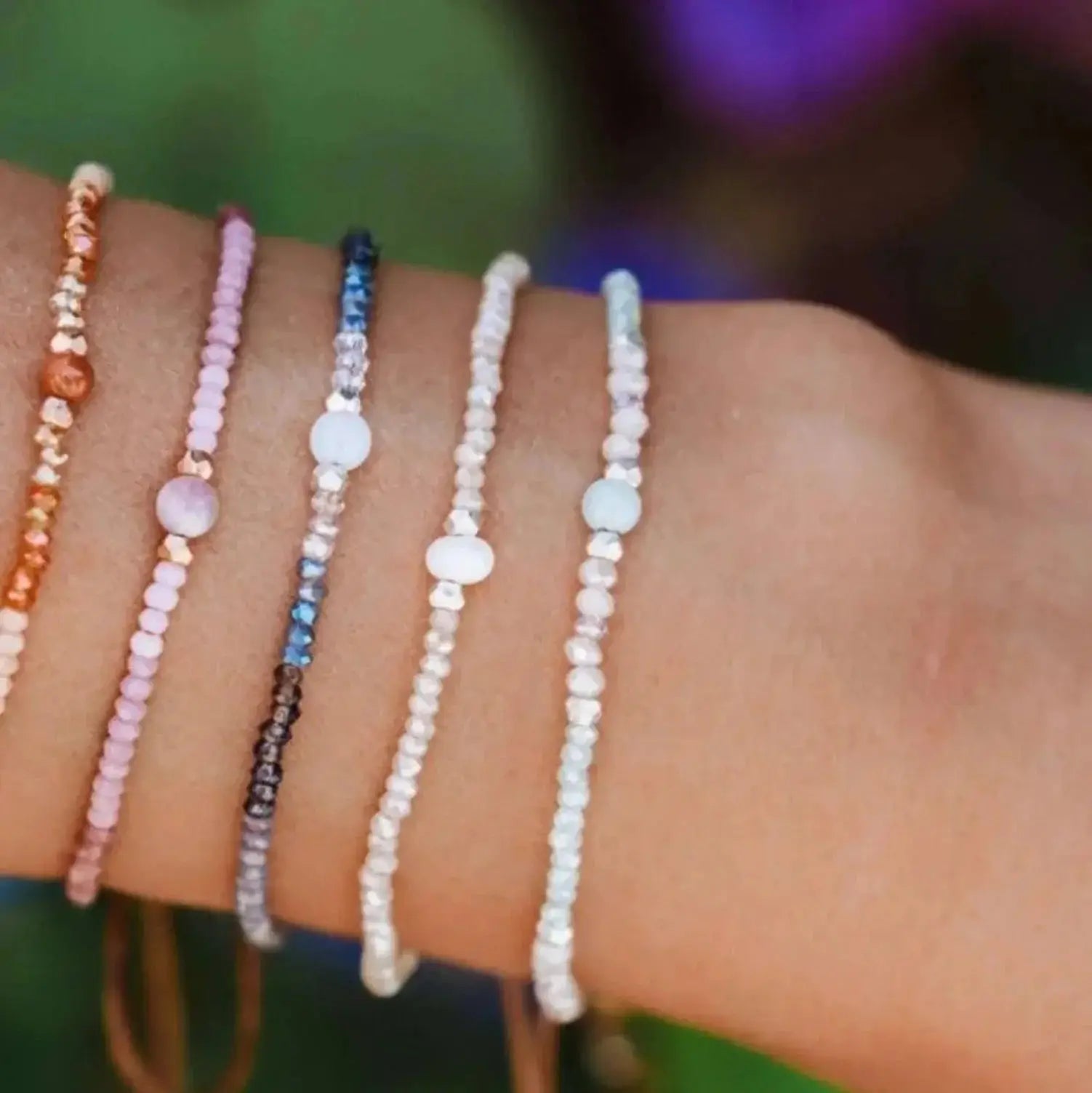 gemstone healing bracelets on a wrist