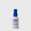 Magic Molecule skin spray bottle with blue cap on a white background