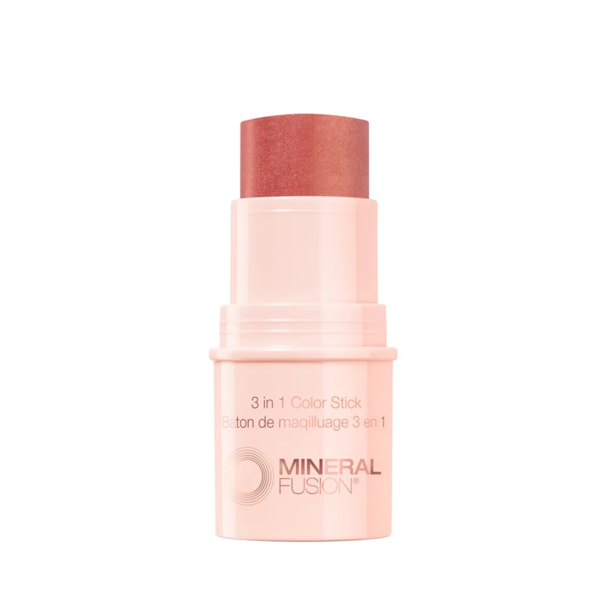 A Mineral Fusion 3-in-1 Color Stick makeup product, showing the peachy-pink cosmetic stick exposed.