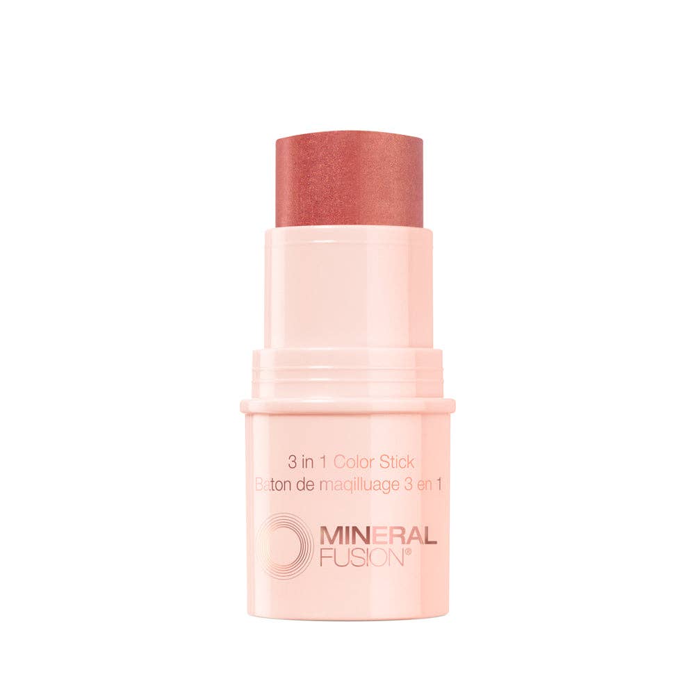 A Mineral Fusion 3-in-1 Color Stick makeup product, showing the peachy-pink cosmetic stick exposed.