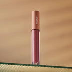 a tube of minori vegan lip gloss in juneberry