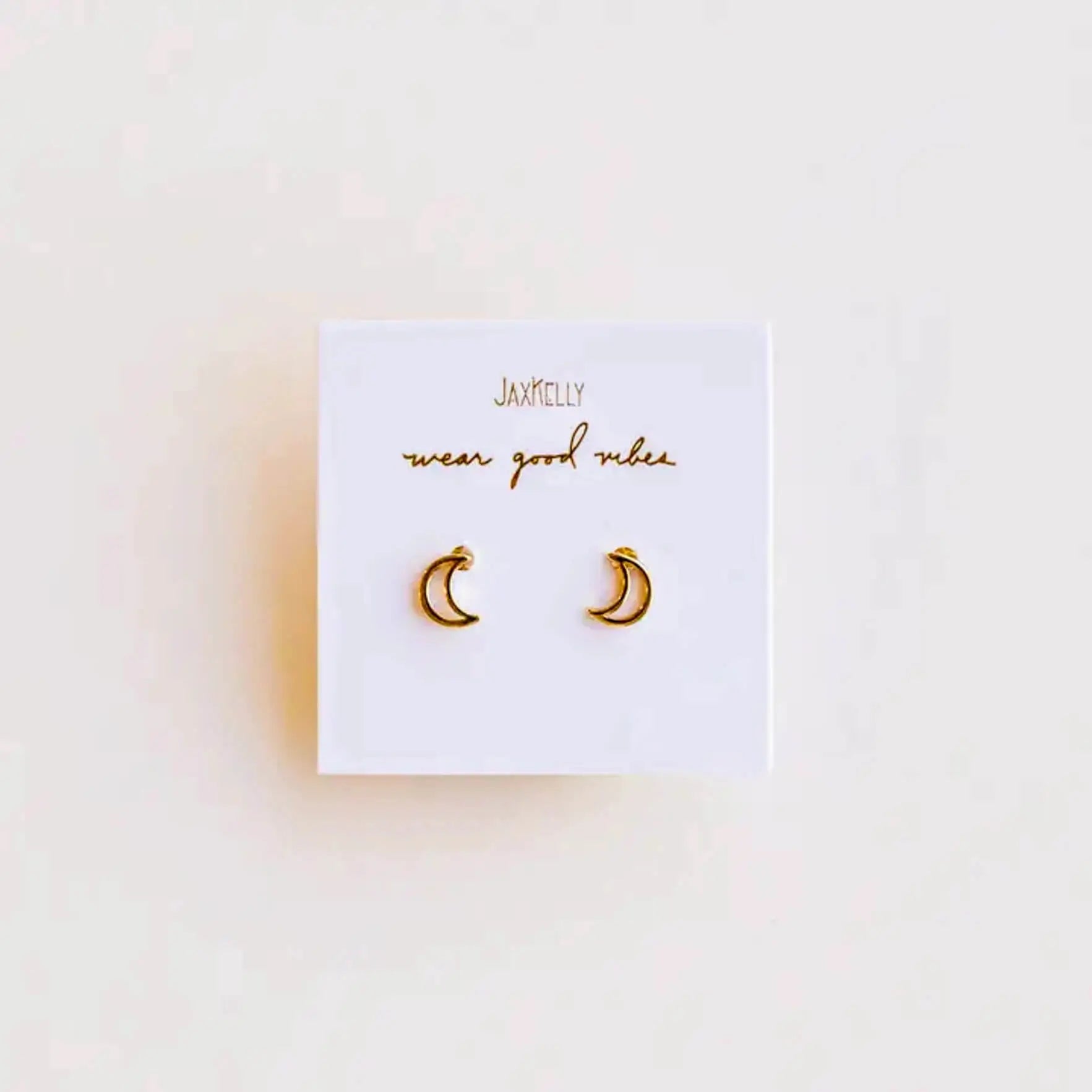 a pair of yellow gold moon shaped earrings