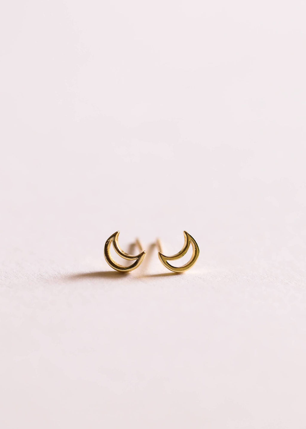 a pair of gold moon stud earrings by JaxKelly 