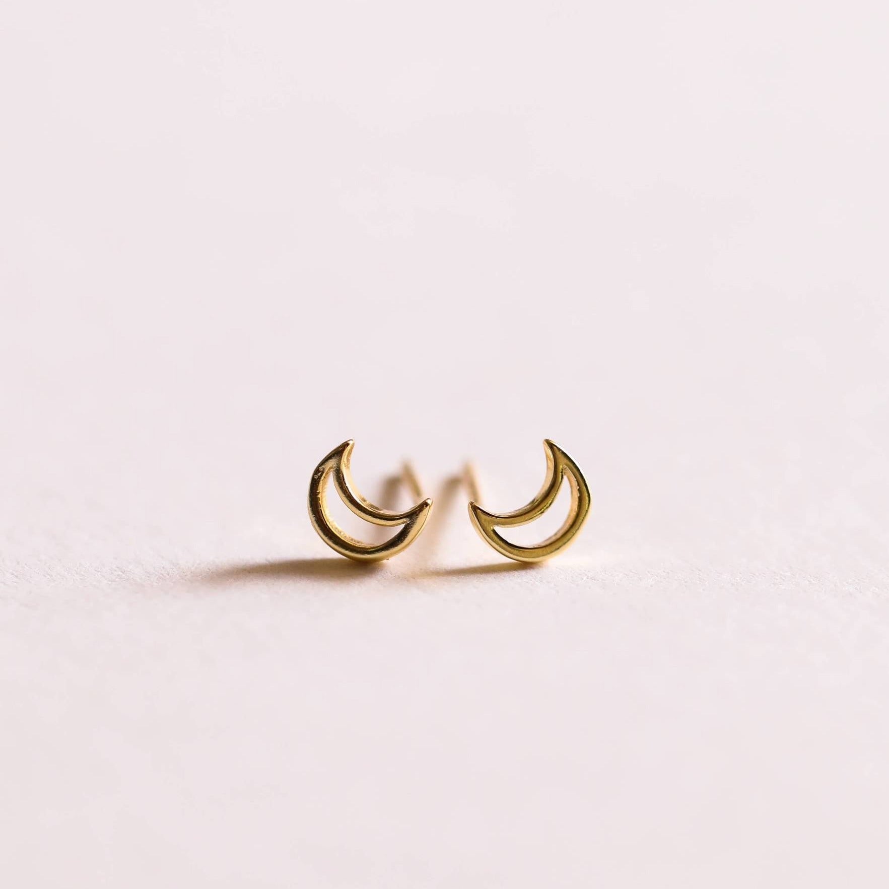 a pair of gold moon stud earrings by JaxKelly 