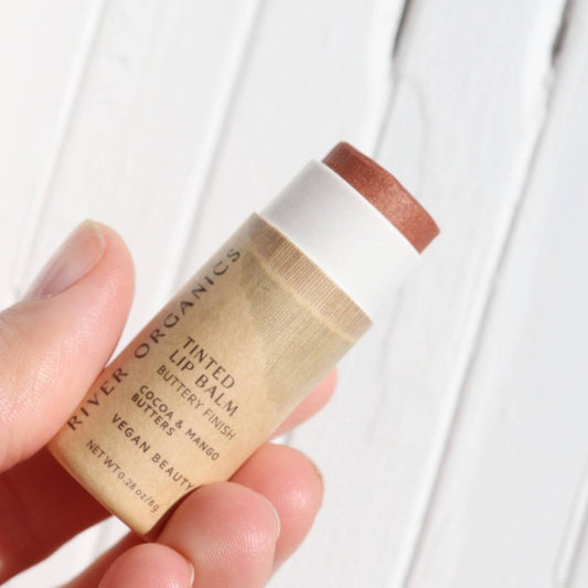 Organic Nude Lip Balm - Vegan Hydration with tinted buttery finish in eco-friendly tube. Made with cocoa and mango butters for soft, nourished lips.