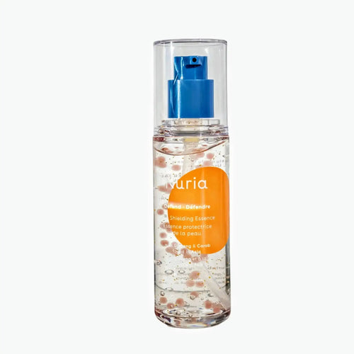 Nuria Defend Skin Shielding Essence Mini, hydrating face serum with visible niacinamide beads in a clear travel-size bottle.