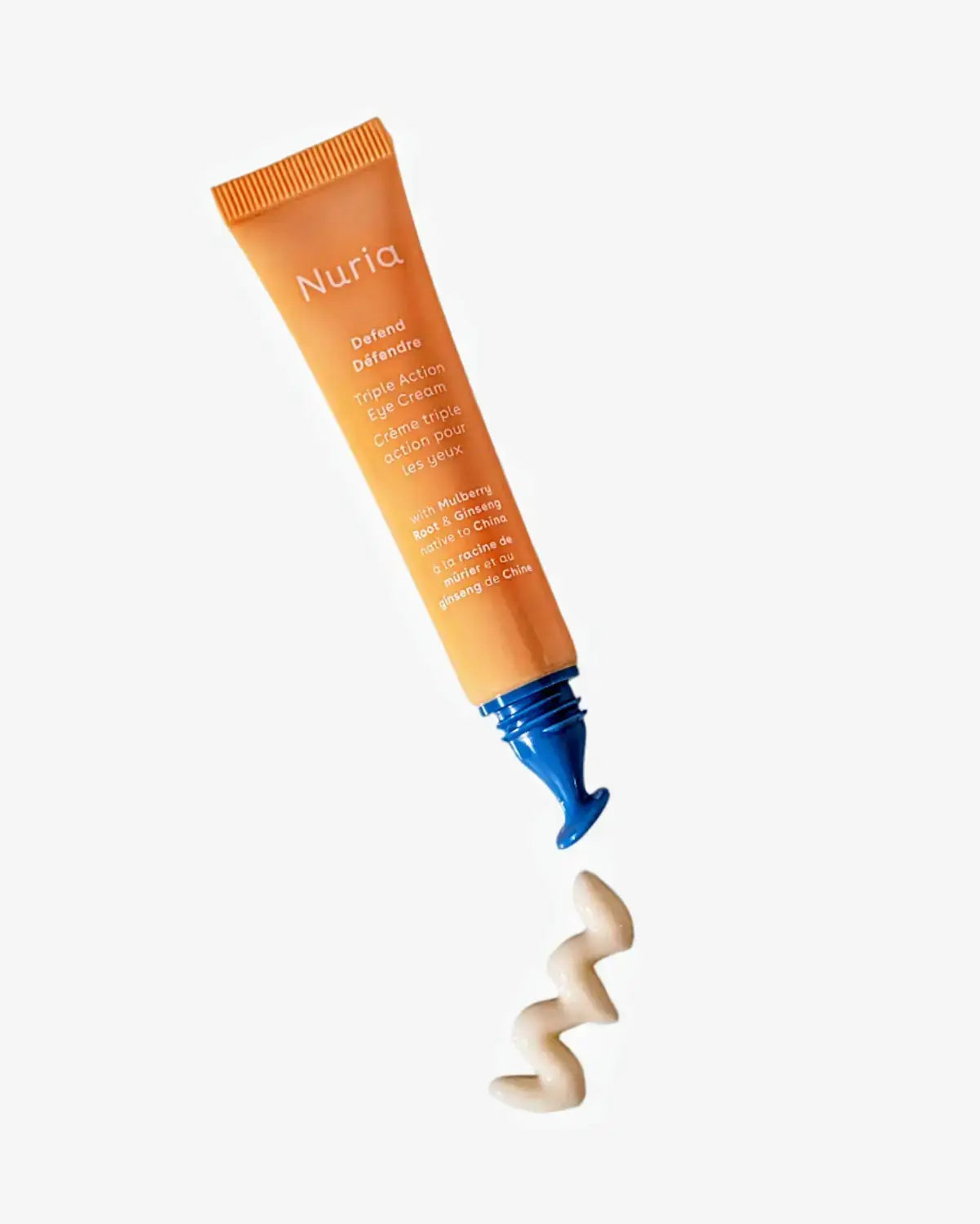 Nuria Eye Cream tube with cream swirled on a neutral background, emphasizing its smooth texture and hydrating formula.