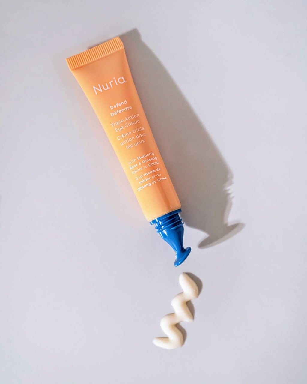nuria defend triple action eye cream in tube with contoured eye applicator, travel size mini