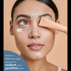 Model applying Nuria Eye Cream under her eye with text promoting radiant and youthful skin benefits.