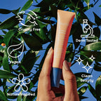 Nuria Eye Cream held against a leafy background with icons highlighting its cruelty-free, vegan, and clean beauty features.