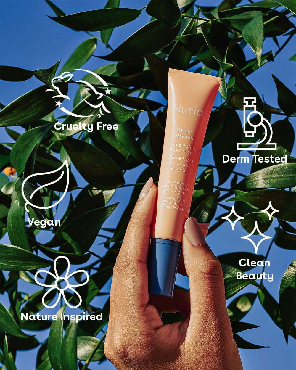 Nuria Eye Cream held against a leafy background with icons highlighting its cruelty-free, vegan, and clean beauty features.