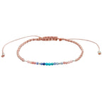 Om Mantra Bracelet - Gemstone Yoga Bracelet with multicolor beads and adjustable pink cord. Ideal for meditation and balance.