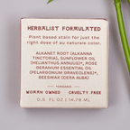 Fat and the Moon Lip and Cheek Stain product packaging with herbalist formulation details on a light background