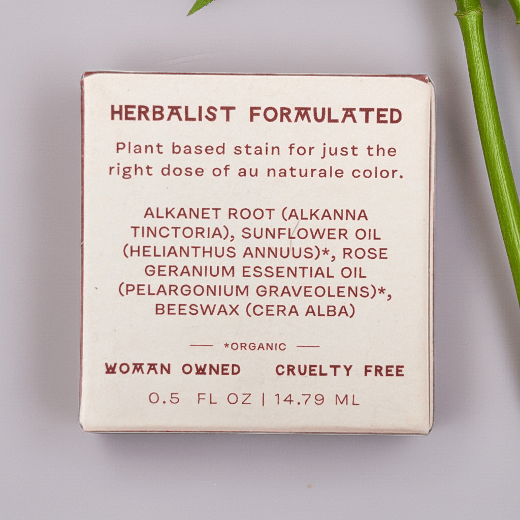 Fat and the Moon Lip and Cheek Stain product packaging with herbalist formulation details on a light background