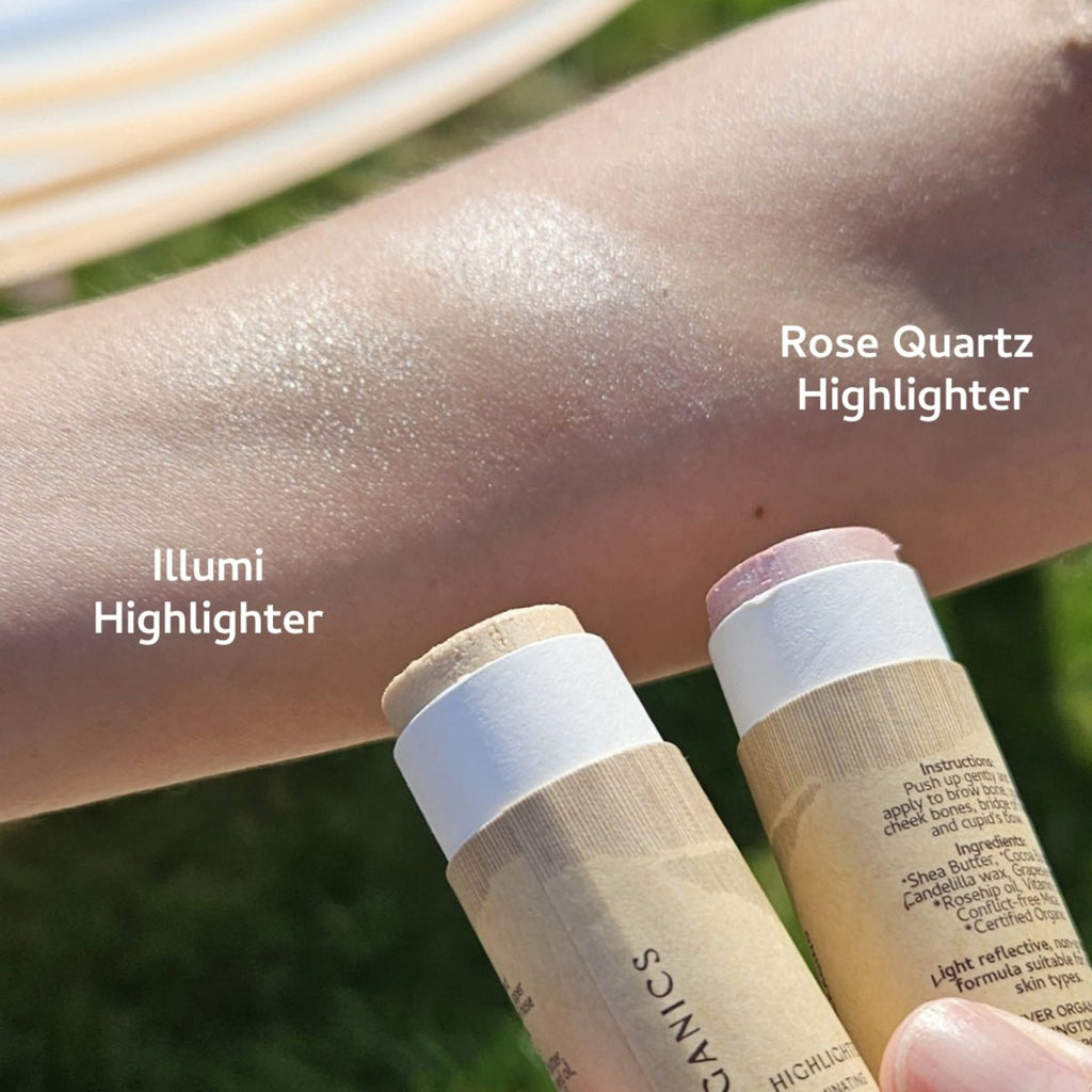 Two highlighter sticks with 'Rose Quartz' and 'Illumi' labels on a person's arm outdoors.