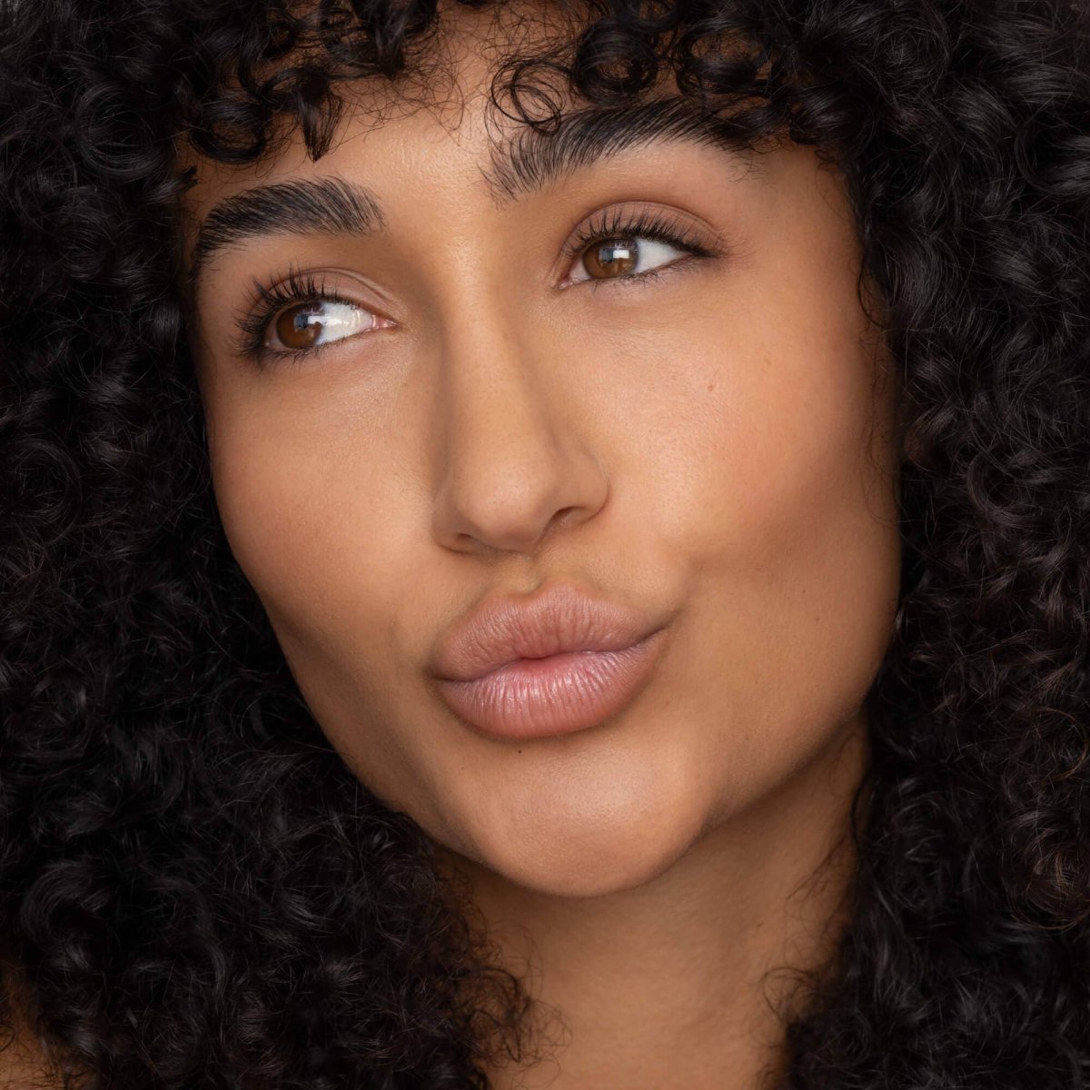 Poppy and Pout Charlie lip tint applied on lips demonstrating a natural everyday cool nude lip tint finish