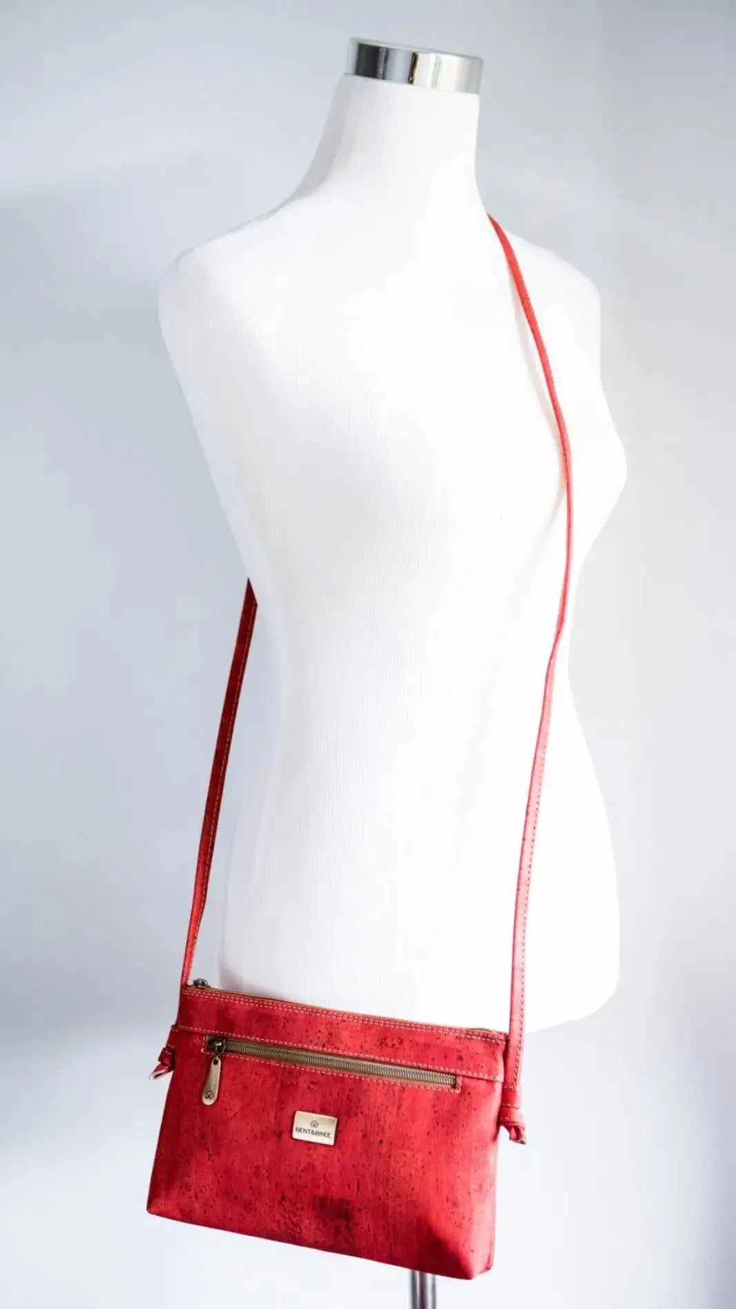 Red crossbody bag on mannequin 