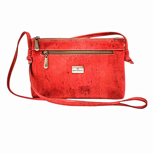 red crossbody handbag made of Portugal cork with gold metal zippered top, front pocket and long shoulder strap
