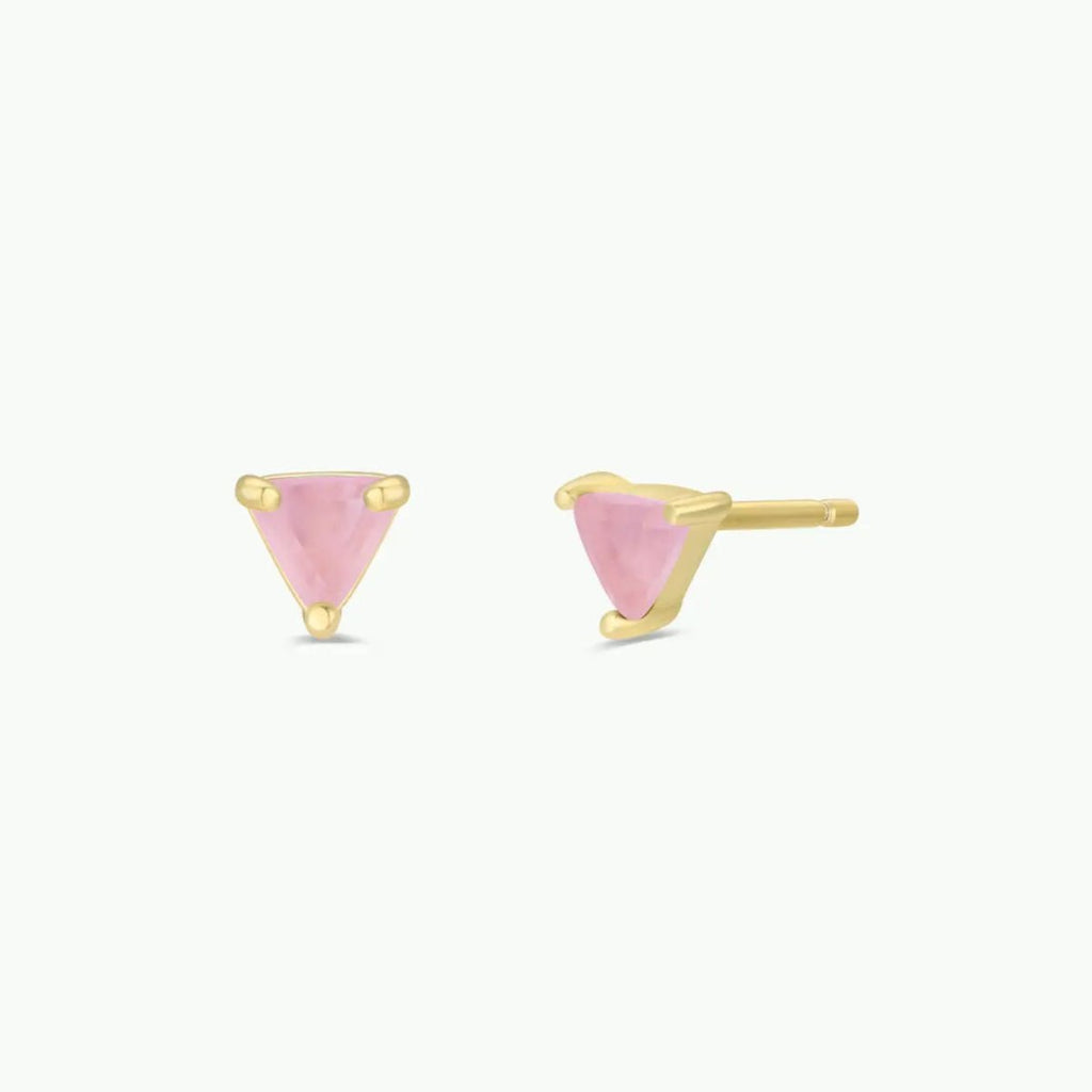 Rose quartz gemstone earrings, gold triangle-shaped earrings with pink stones on a white background.