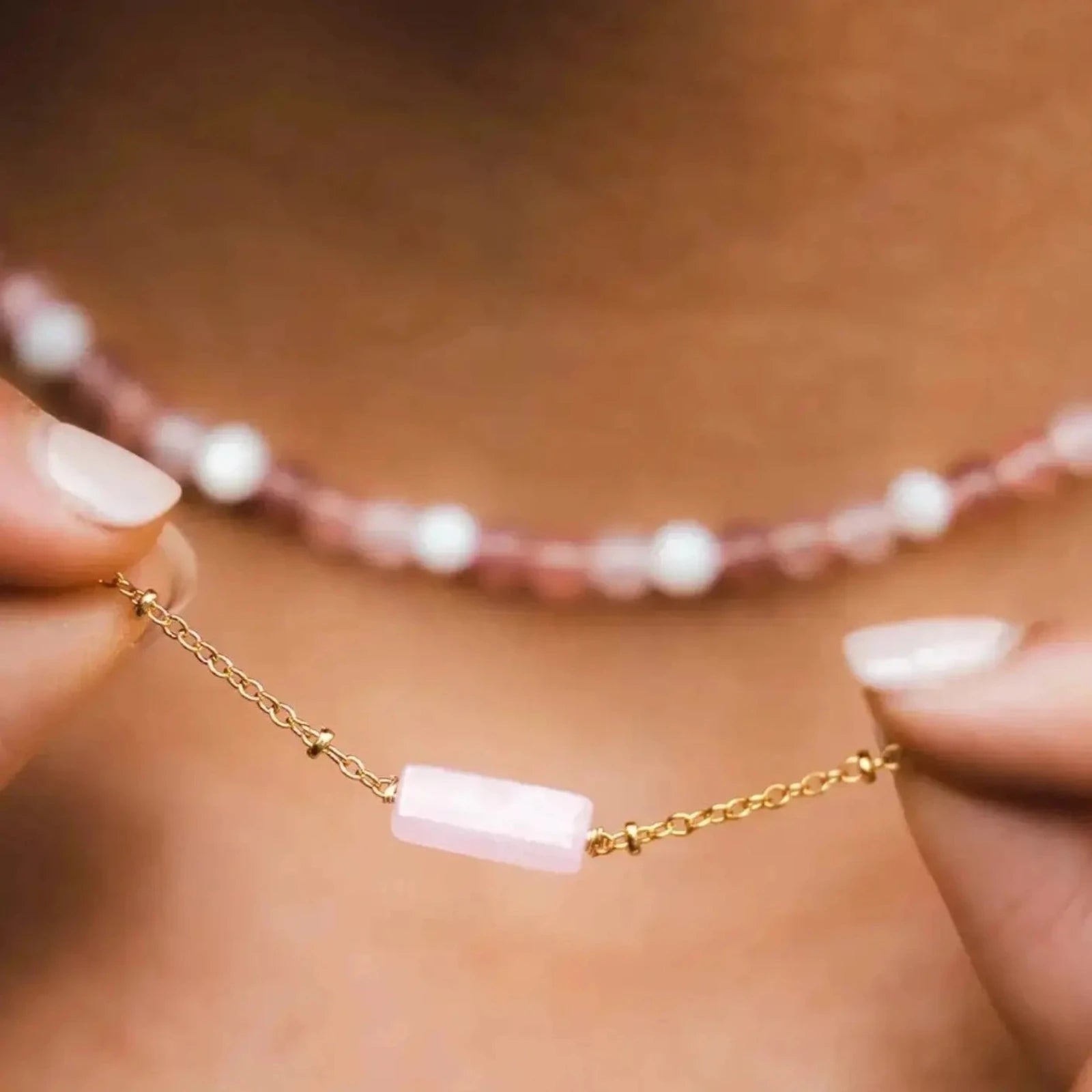 Rose Quartz Stone Necklace on Gold Chain shown on a Model