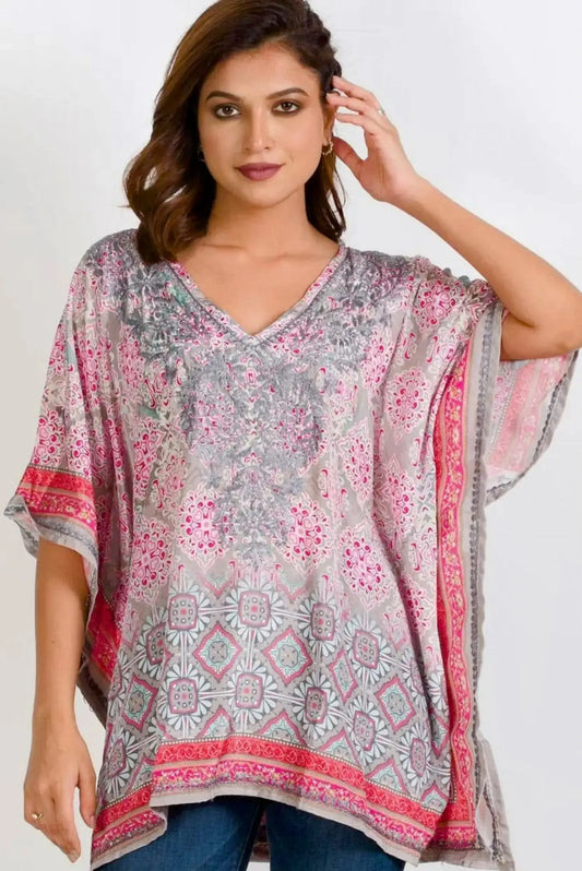 Embroidered long tunic top with v-neck and flowy short sleeves in a pink and grey print