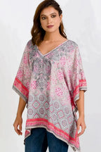 The Taneesha Embroidered Tunic Top pullover style v-neck, long length, sharkbite hem, flattering kimono style short sleeves.