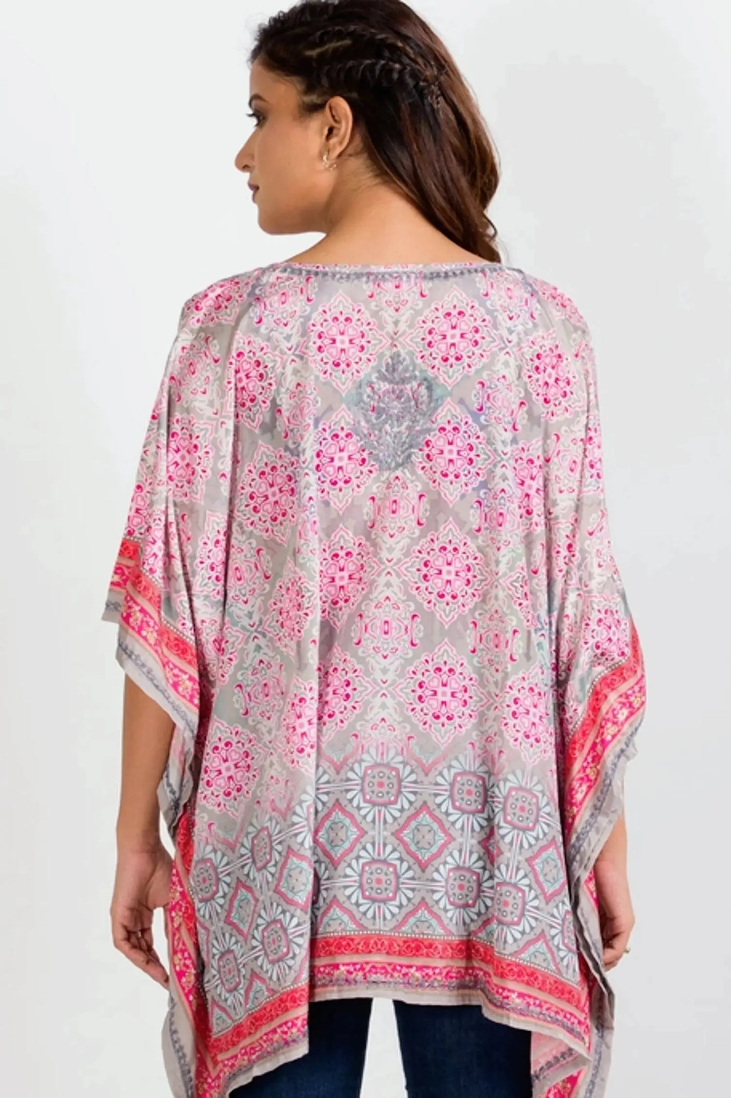 The Taneesha Embroidered Tunic Top  in grey and pink pattern with a pullover style v-neck, long length, sharkbite hem and flattering kimono style short sleeves with embroidered back