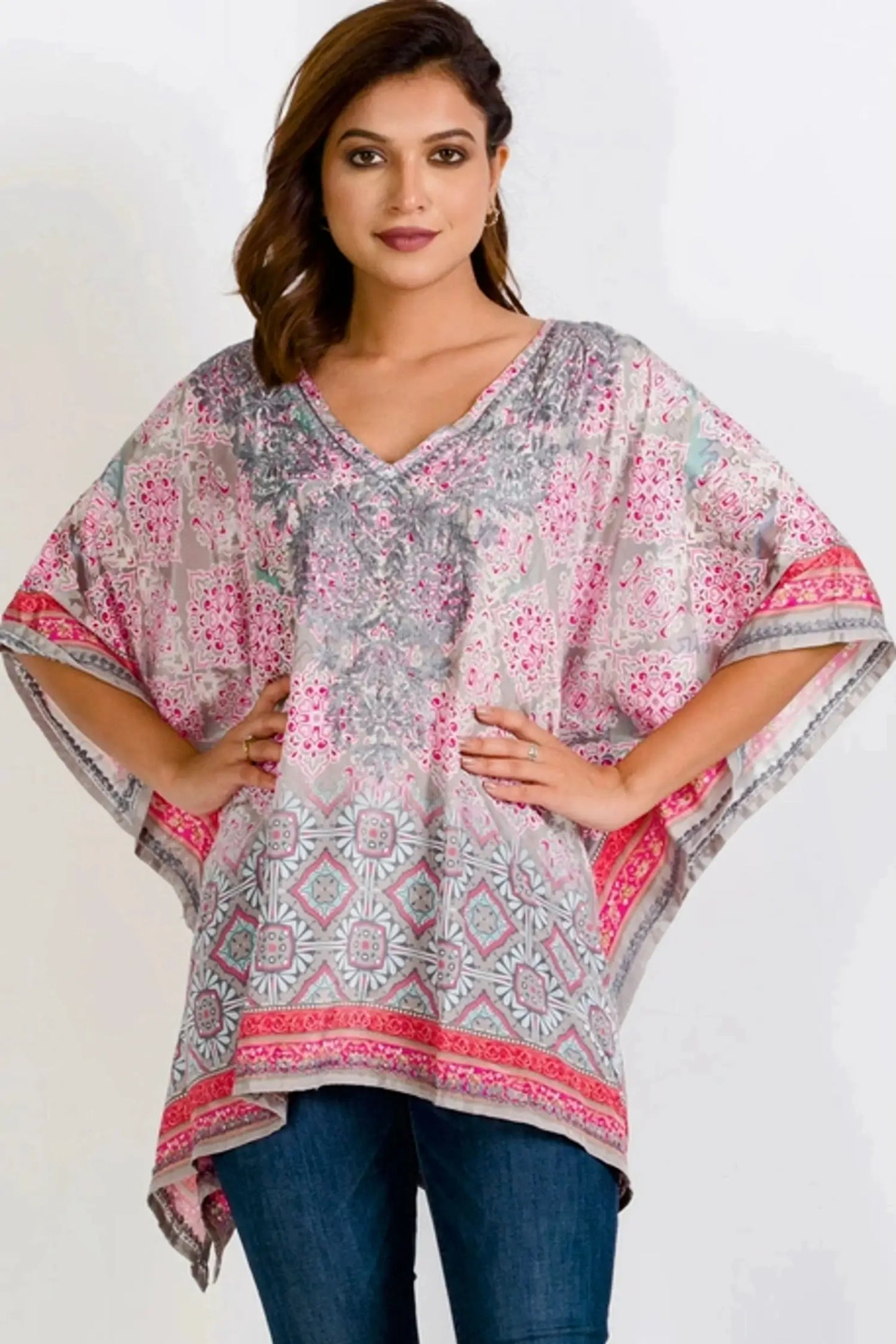 The Taneesha Embroidered Tunic Top  in grey and pink pattern with a pullover style v-neck, long length, sharkbite hem and flattering kimono style short sleeves