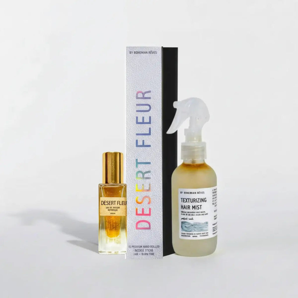 Desert Fleur hair mist bottle, incense box and rollerball perfume with packaging on a light gray background