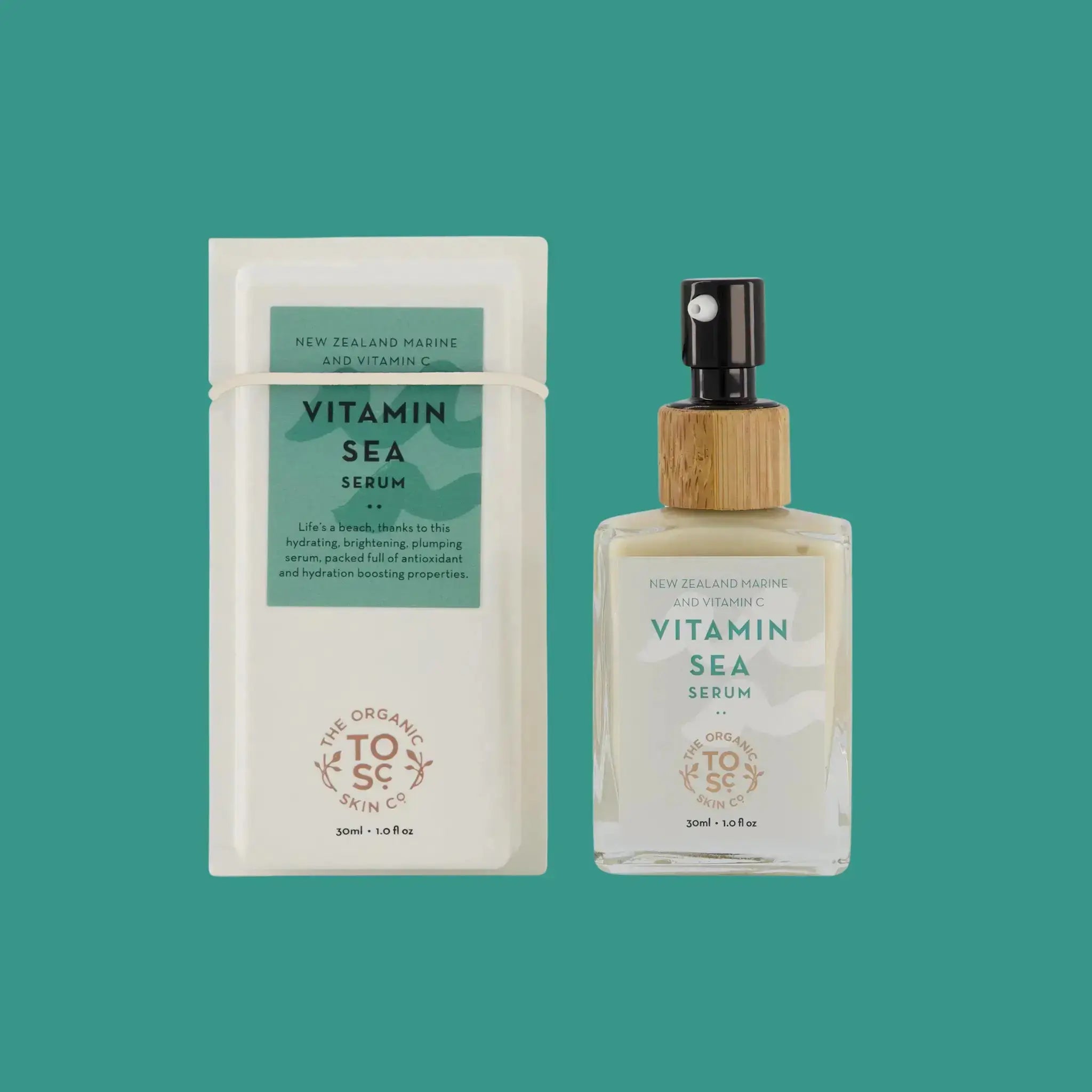The Organic Skin Co. Vitamin Sea Serum in a glass pump bottle sea next to a box