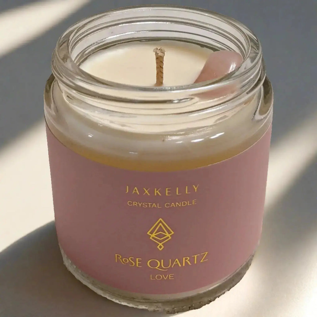 a rose quartz candle that is sitting on a table