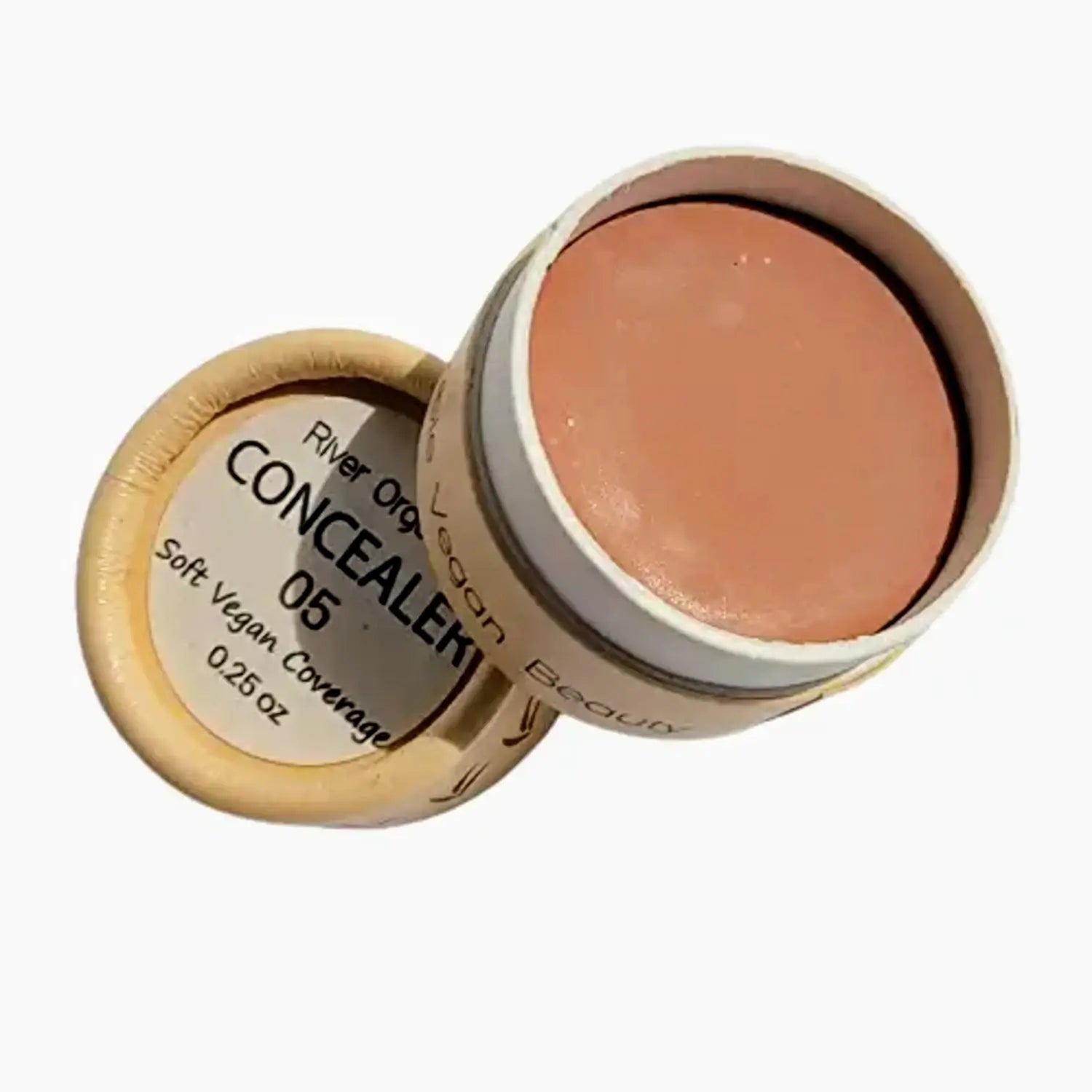 vegan cream concealer in medium dark color in a eco- friendly paper jar with lid