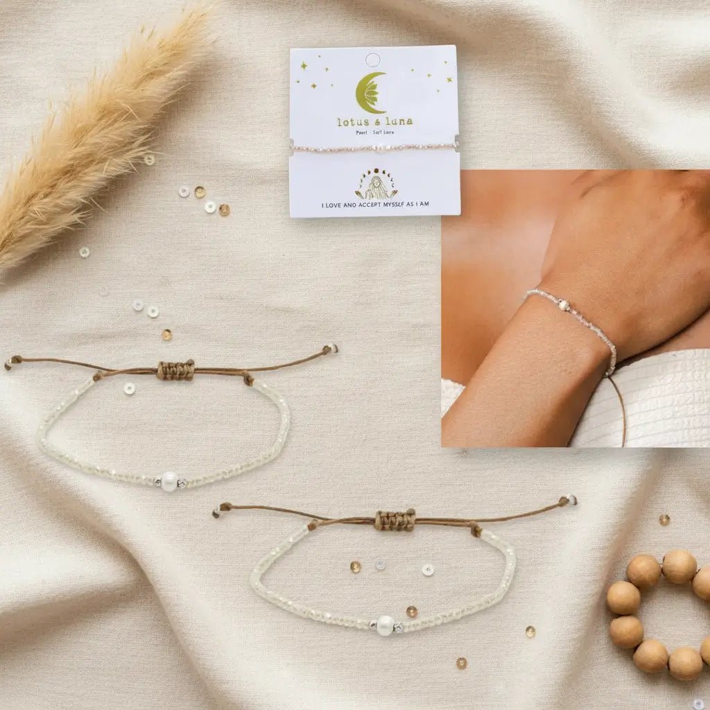 Pearl bracelet featuring a white freshwater pearl in the center surrounded by silver beads and white crystals.