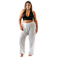 curvy model wearing a pair of white cotton wide leg pants for lounge or beachwear