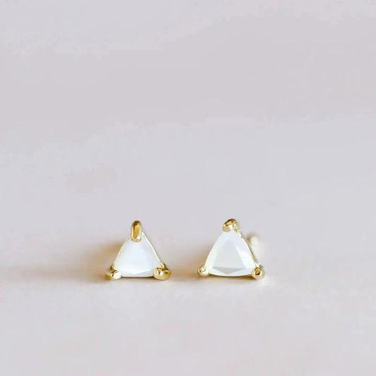 White Mother of Pearl triangle stud earrings set in gold by JaxKelly, minimalist gemstone earrings for elegant everyday wear.