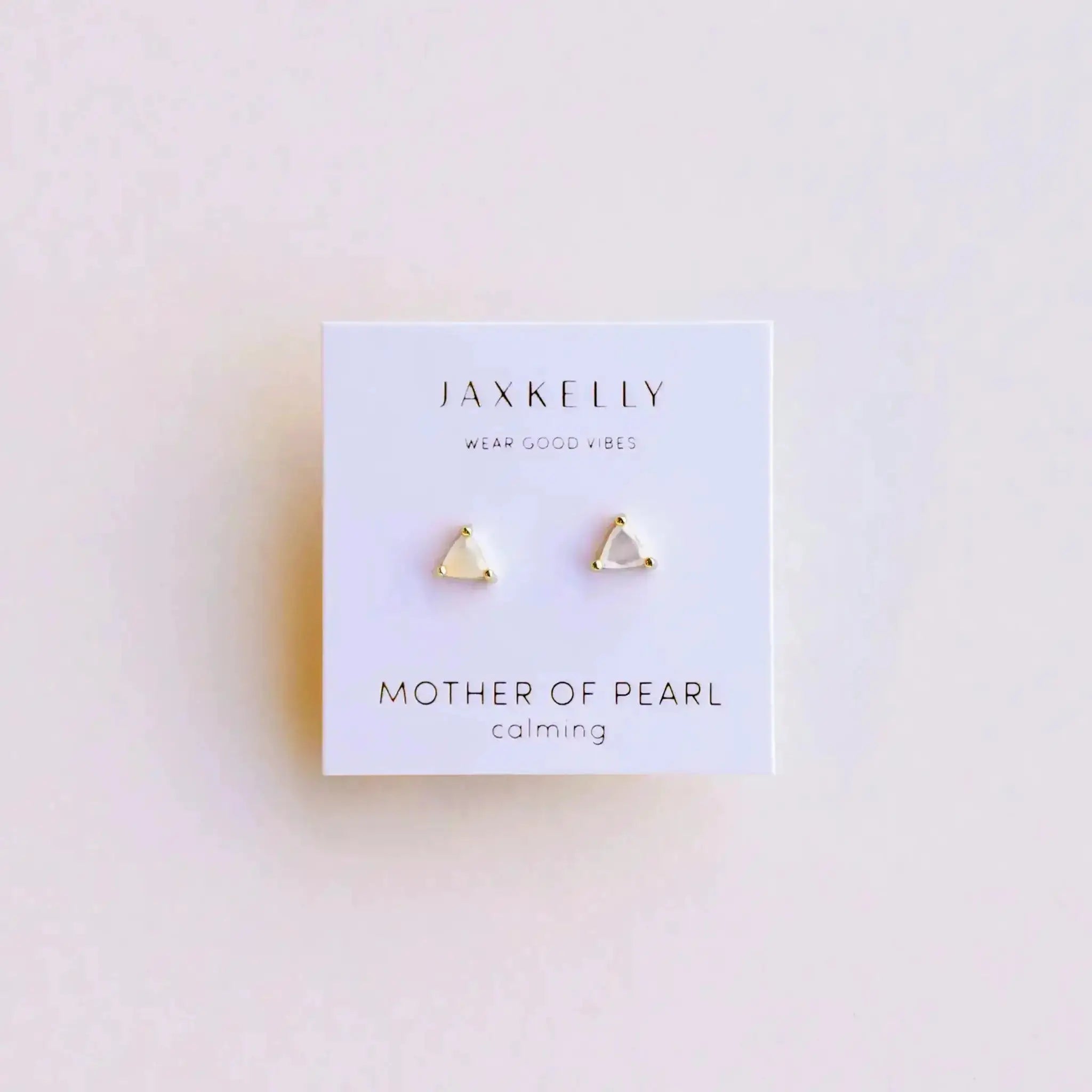White Mother of Pearl Earrings by JaxKelly featuring minimalist gold triangle stud design. Elegant gemstone earrings for everyday wear or special occasions.