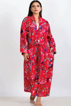 woman wearing a long red cotton kimono robe with long sleeves, pockets and belt, maxi length