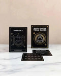 Yoga cards with illustrations and text on a marble surface. Yoga Pose and Meditation Cards for Adults by High Desert Yogi.