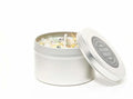 Healing Energy Candle infused with crystals, gemstones and herbs in an 8oz. metal travel tin. From New Moon Beginnings